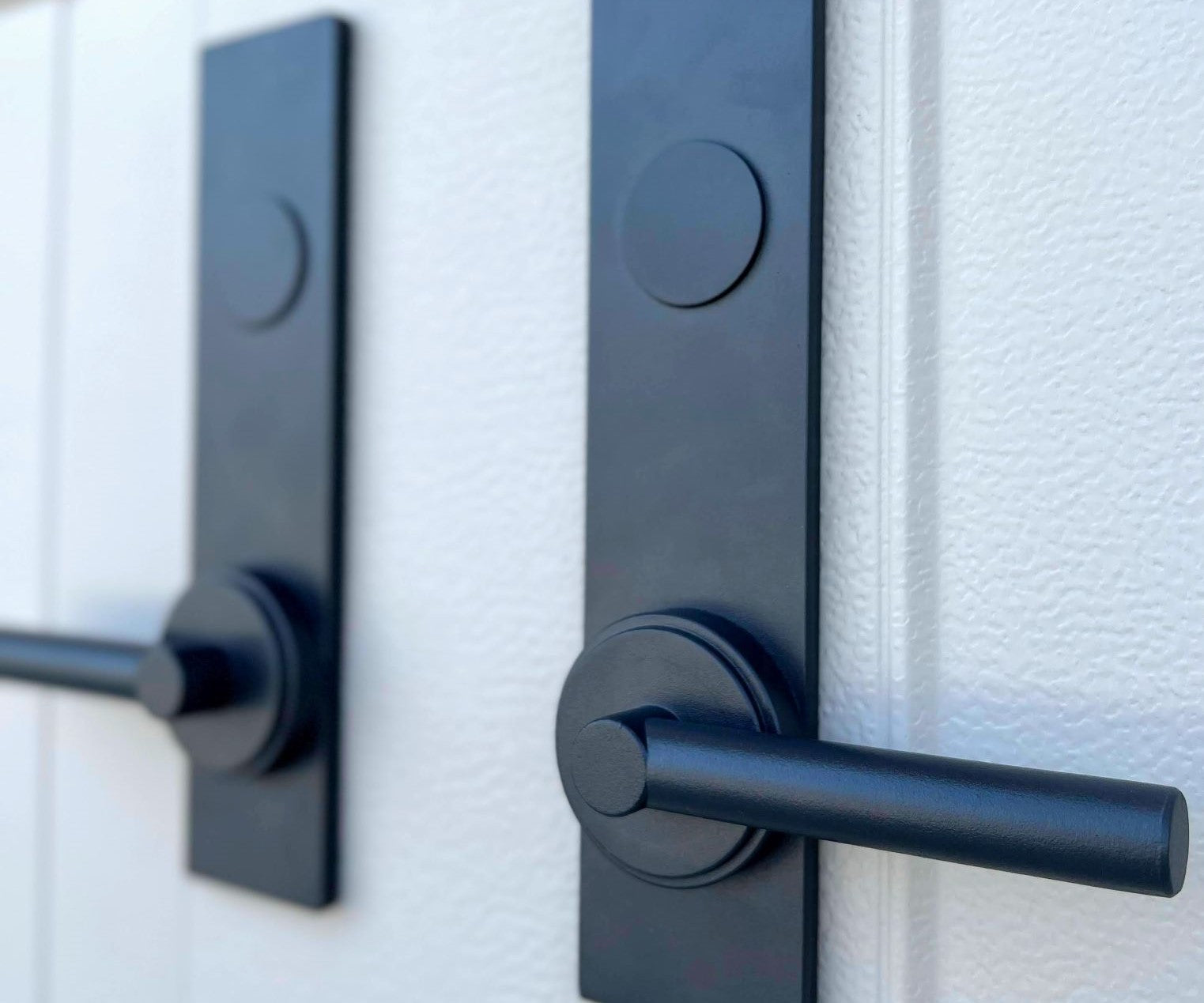 New decorative magnetic garage door hardware handles that have a modern style.